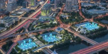 Modern cityscape with smart infrastructure elements glowing at dusk, representing US urban development.
